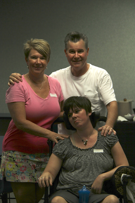 Rita with her parents after her catastrophic brain injury.